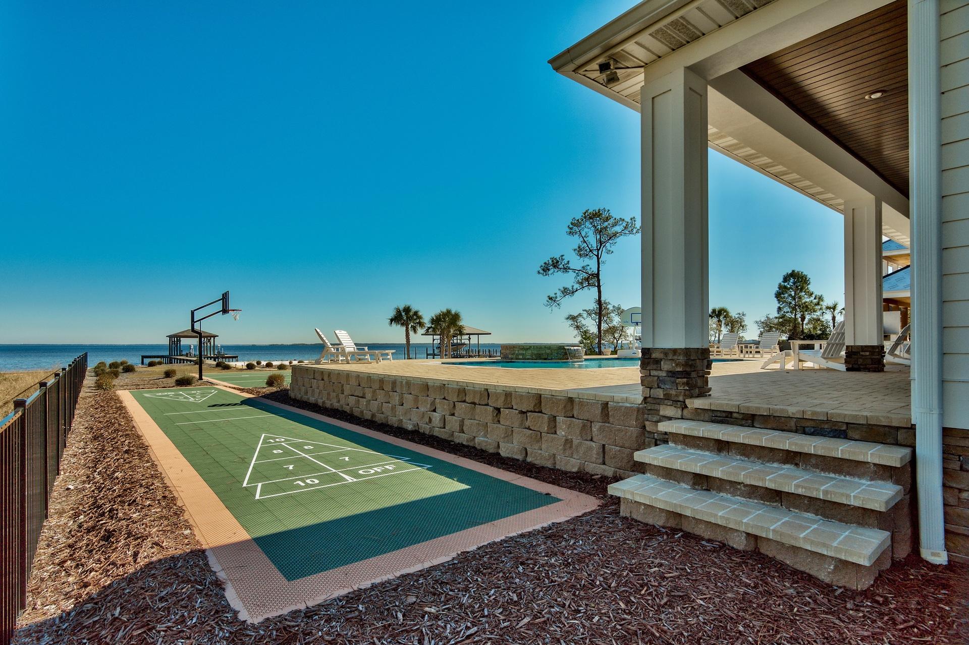 1591 Driftwood Point Road Santa Rosa Beach, FL 32459 - Photo 39 of 50 a view of a backyard with plants and a patio