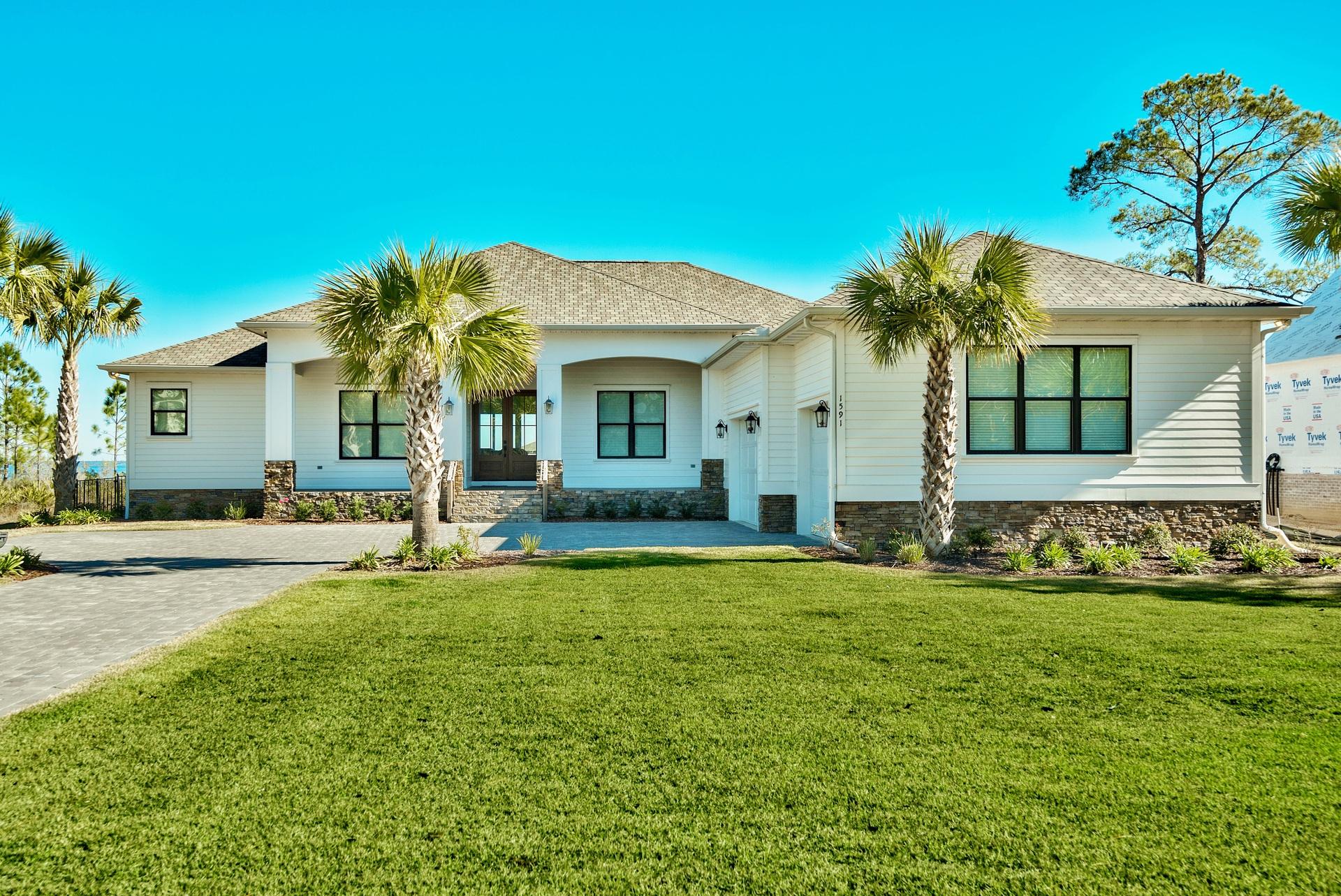 1591 Driftwood Point Road Santa Rosa Beach, FL 32459 - Photo 5 of 50 a front view of a house with a yard