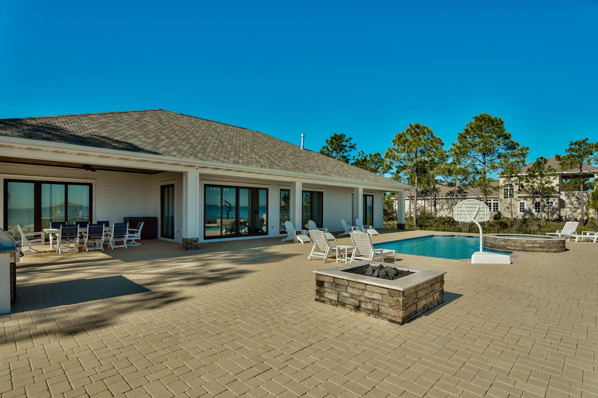 1591 Driftwood Point Road Santa Rosa Beach, FL 32459 - Photo 41 of 50 a front view of a house with swimming pool and glass windows