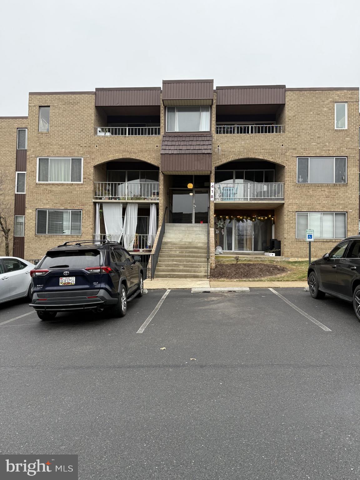 a view of a car park in front of building