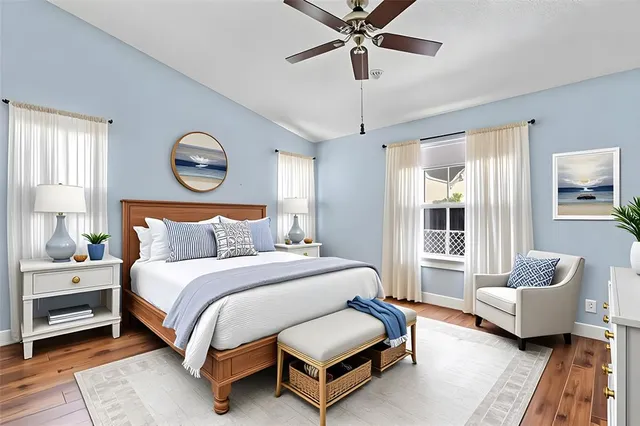 a spacious bedroom with a bed couch and a window