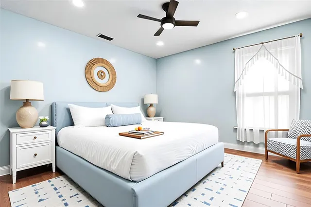 a bedroom with a bed and a table