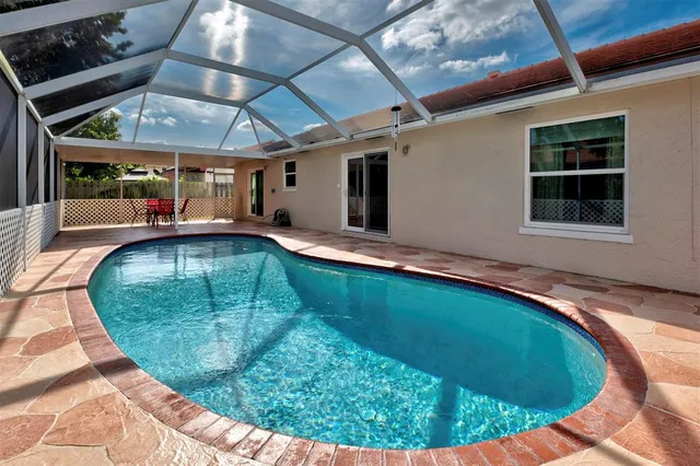 a view of a swimming pool with a patio