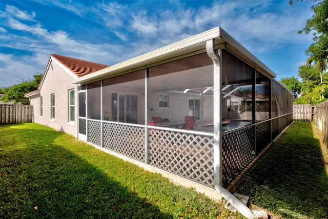 a view of backyard with cabin