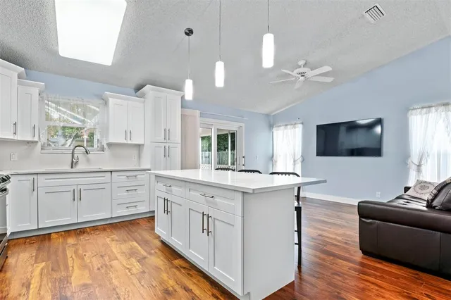 a view of living room with granite countertop furniture and fireplace
