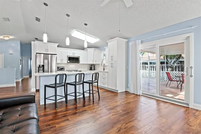 a view of a kitchen and dining room