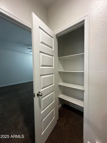 a view of a big room with carpet