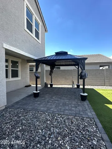 a view of a house with a yard and a garden