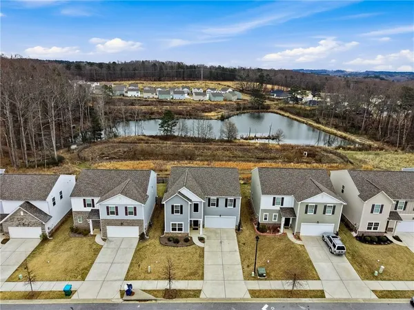 an aerial view of residential houses with outdoor space