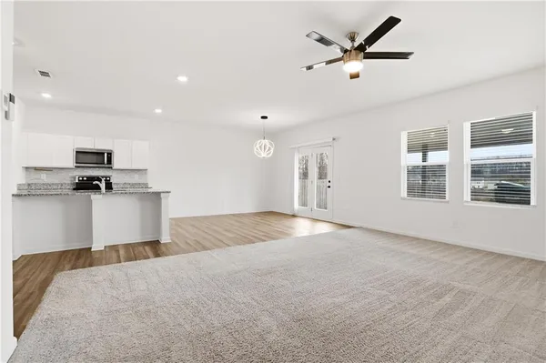 a view of a kitchen with a sink and a window