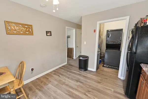 a view of a livingroom with wooden floor and chair