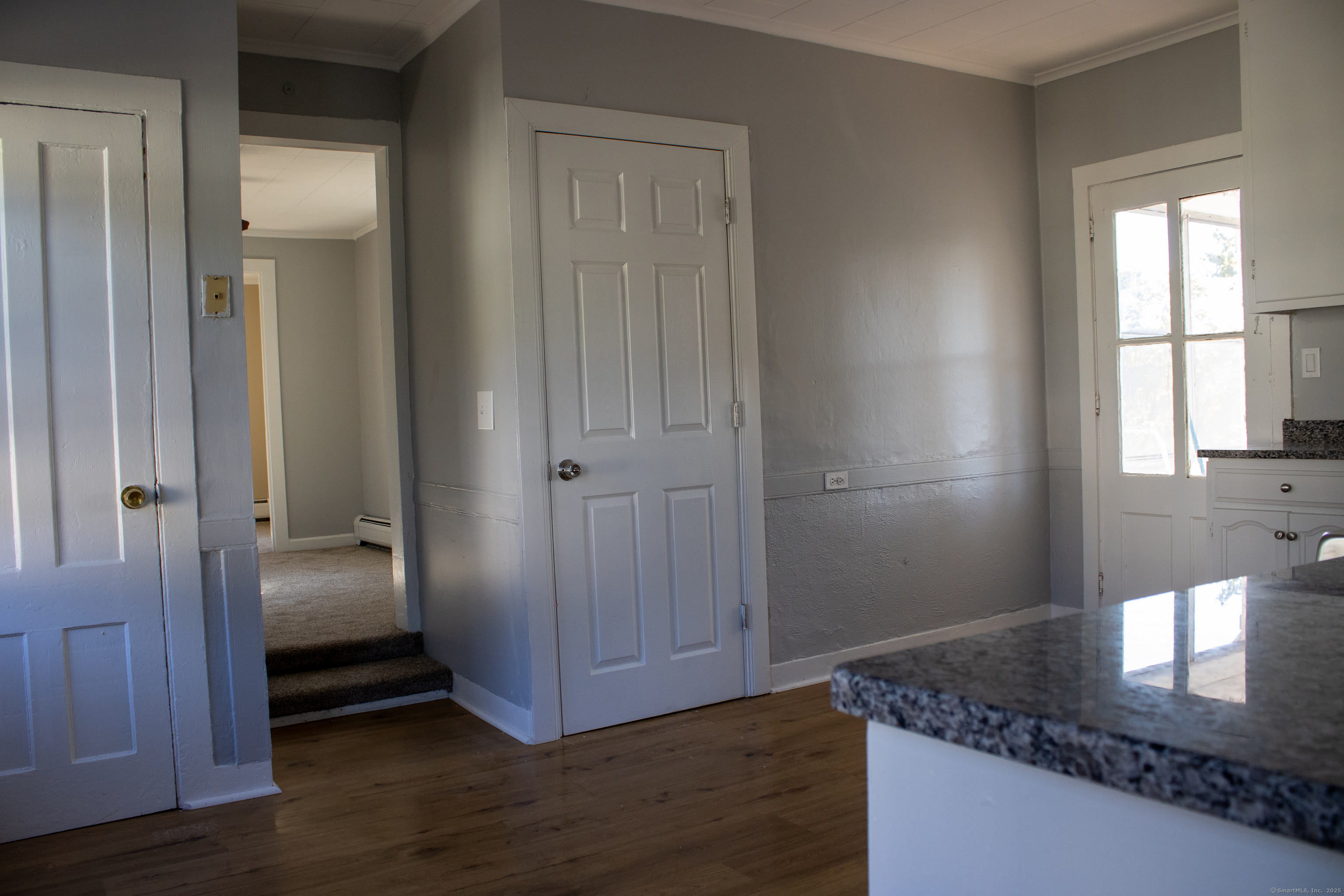 34 Fair Street Wallingford, CT 06492 - Photo 5 of 22 a view of a hallway with wooden floor and closet area