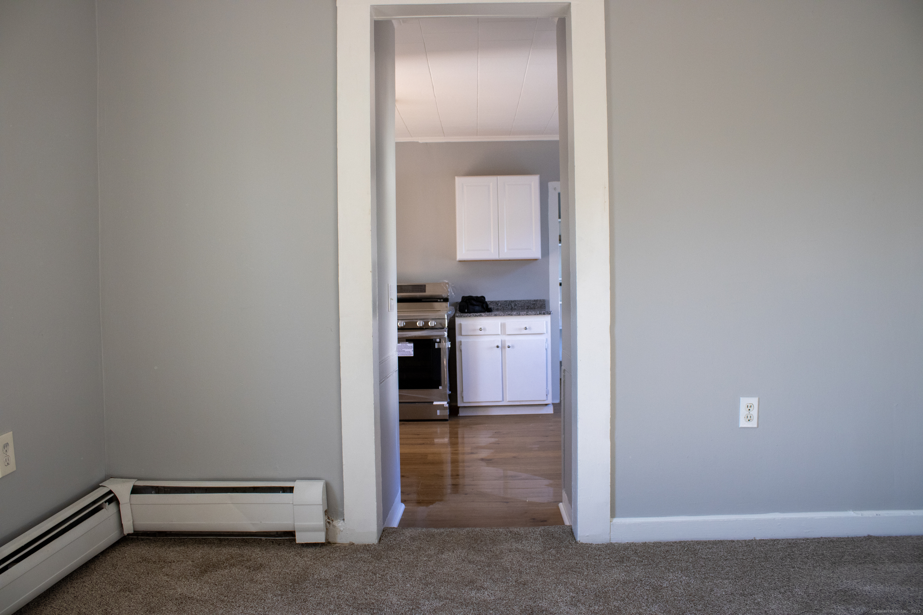 34 Fair Street Wallingford, CT 06492 - Photo 10 of 22 a view of a hallway with kitchen