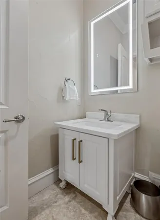 a bedroom with bed and wooden floor