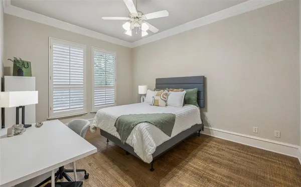 a bedroom with a bed and a mirror