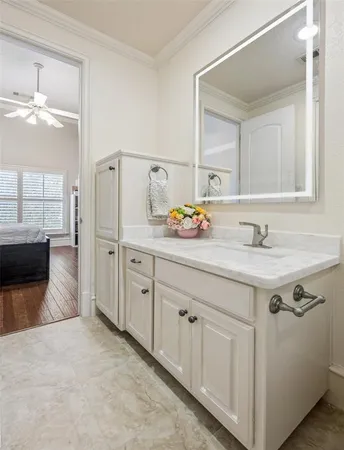 a view of a house with a large window and wooden fence