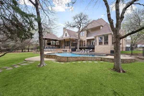 a view of a swimming pool with a patio
