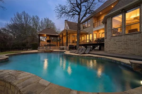 a front view of a house with swimming pool