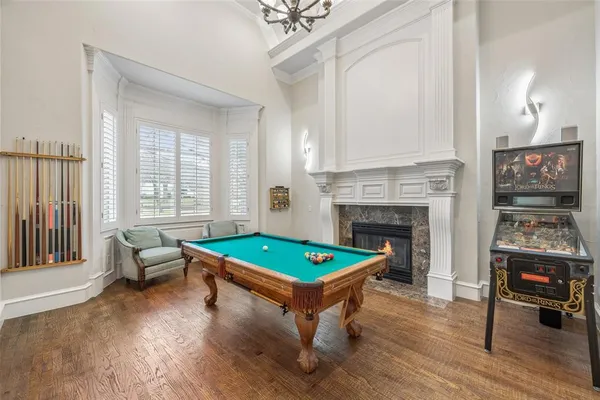 a workspace with wooden floor and windows