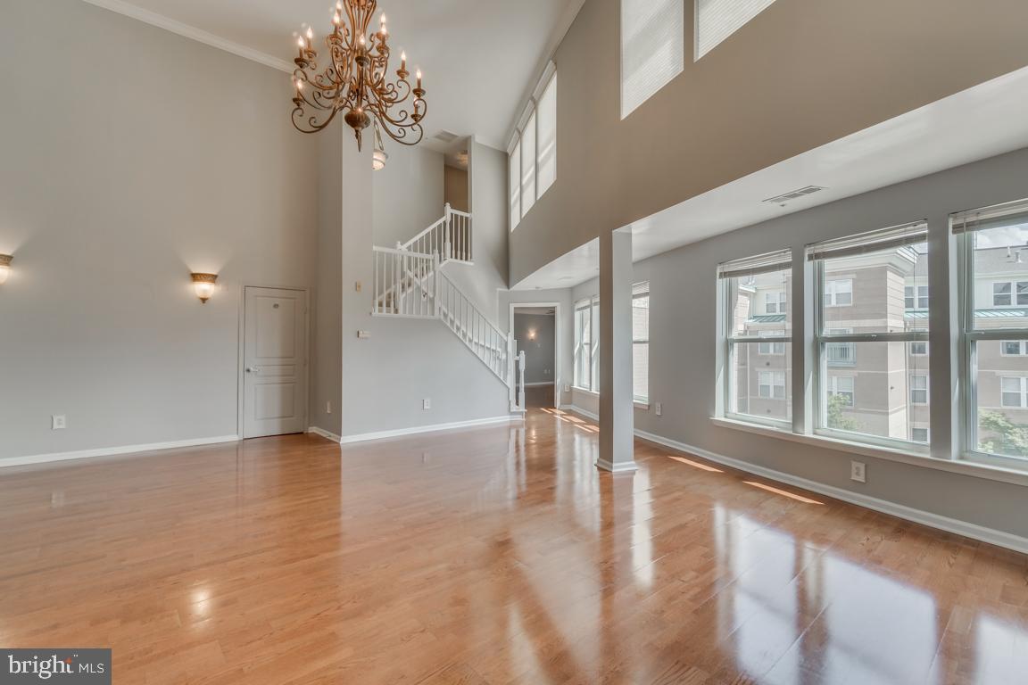 12000 Market Street, Unit 419 Reston, VA 20190 - Photo 15 of 38 Elegant light fixtures and soaring chandelier