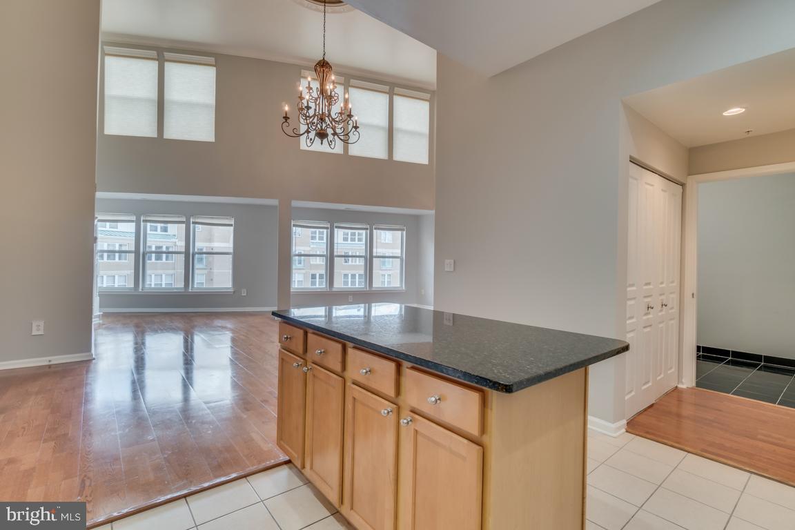 12000 Market Street, Unit 419 Reston, VA 20190 - Photo 7 of 38 Open concept with expansive two-story ceiling
