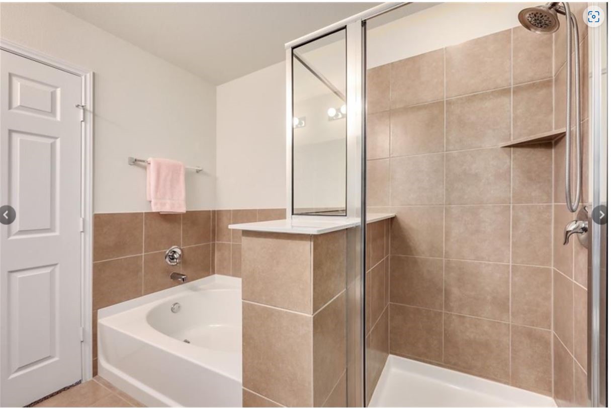 169 Marcheeta Way Leander, TX 78641 - Photo 17 of 30 a bathroom with a bathtub and a shower