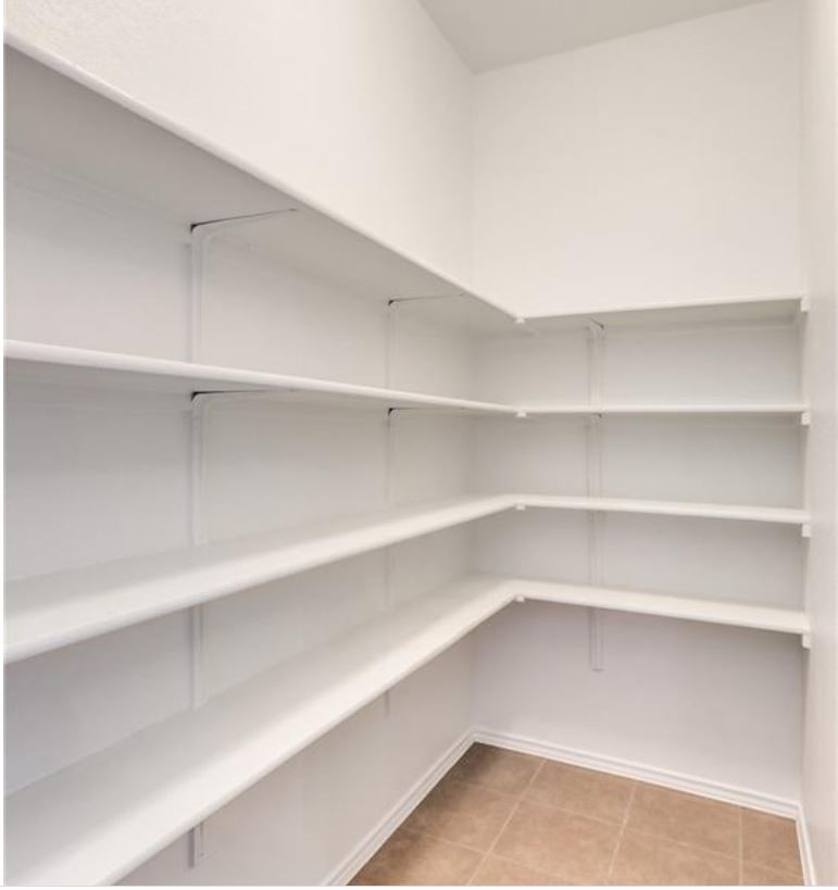 169 Marcheeta Way Leander, TX 78641 - Photo 9 of 30 a view of walk in closet with empty racks