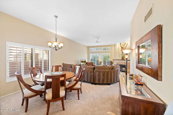a view of a dining room with furniture window and outside view