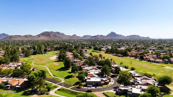 a view of a city with mountains in the background
