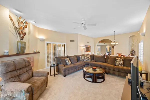 a living room with furniture and a large window