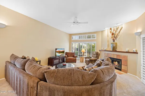 a living room with furniture and a fireplace