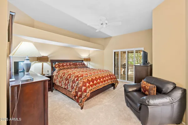 a bed room with a bed and a couch