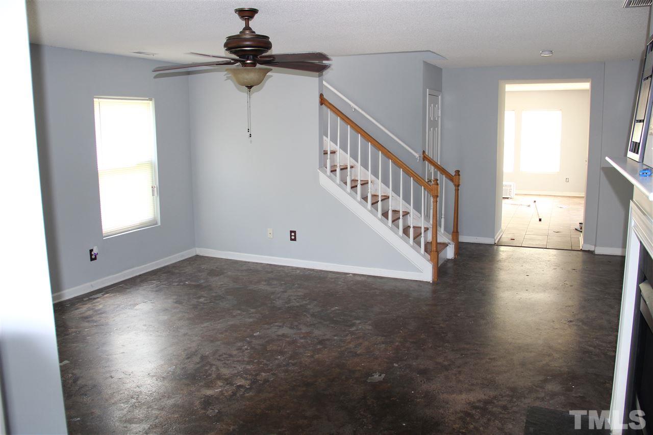 2609 Quarry Ridge Lane Raleigh, NC 27610 - Photo 3 of 12 a view of a livingroom with wooden floor stairs