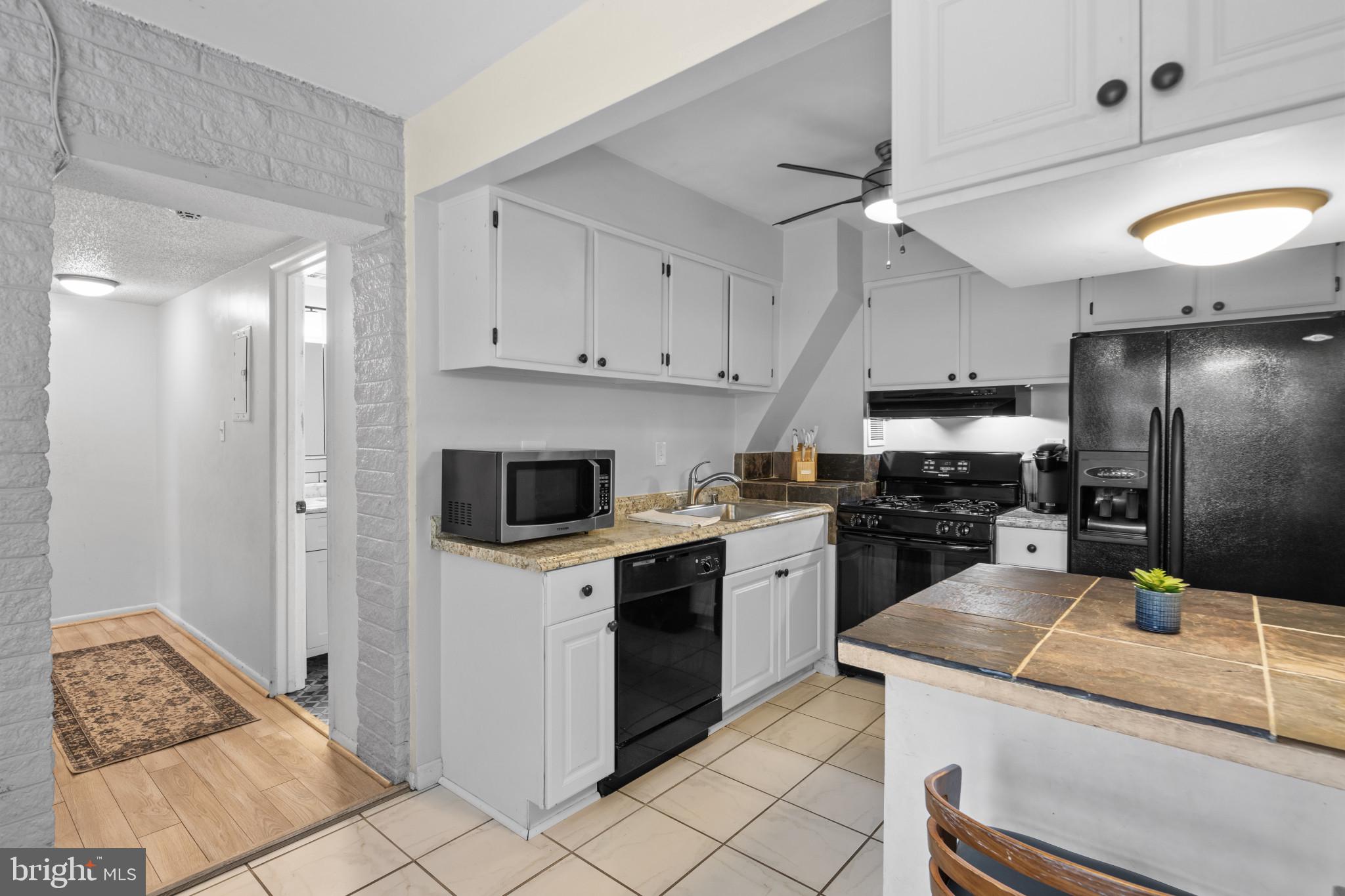 1824 Metzerott Road, Unit B5 Adelphi, MD 20783 - Photo 1 of 25 a kitchen that has a lot of cabinets in it and appliances