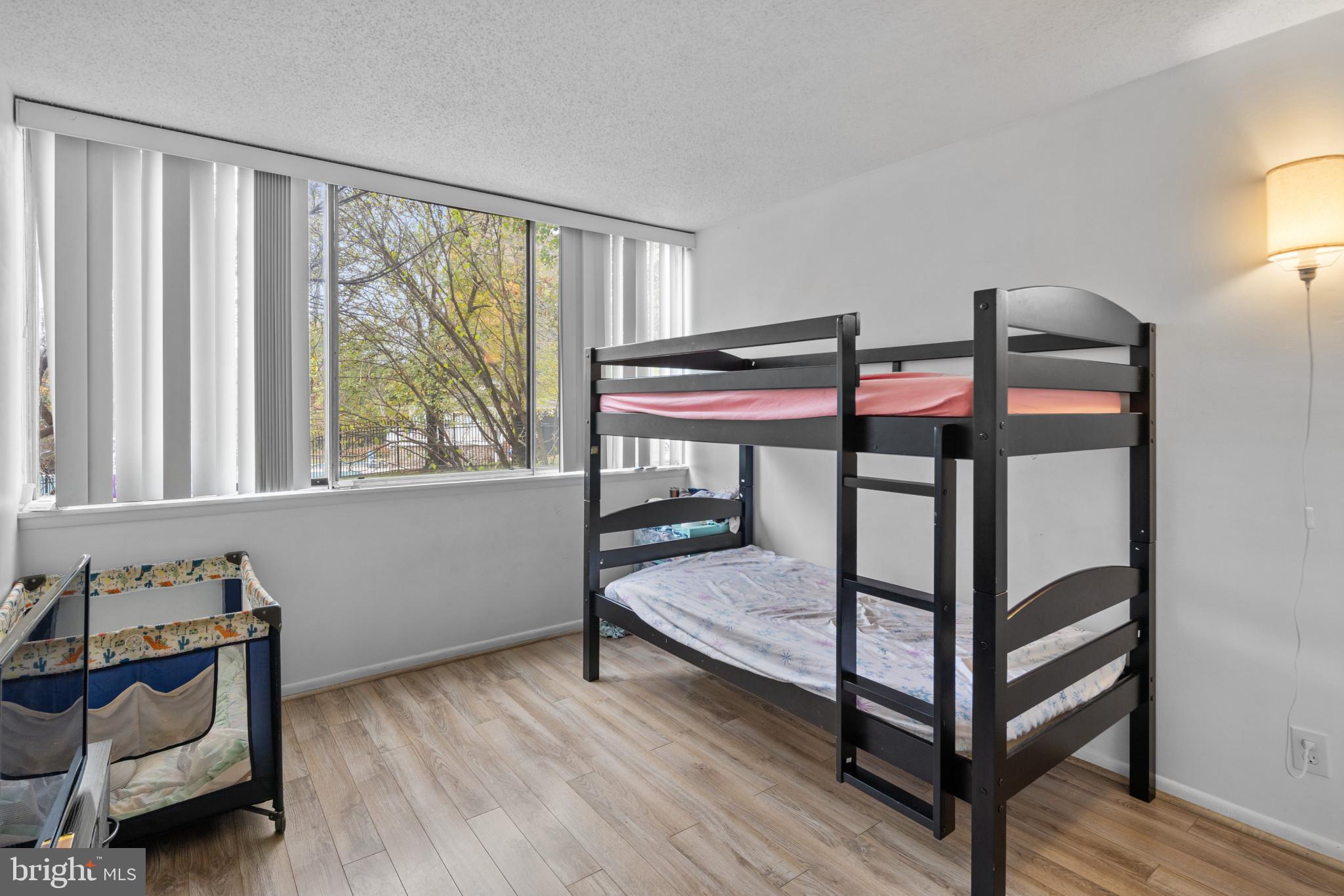 1824 Metzerott Road, Unit B5 Adelphi, MD 20783 - Photo 11 of 25 a bedroom with furniture and a window