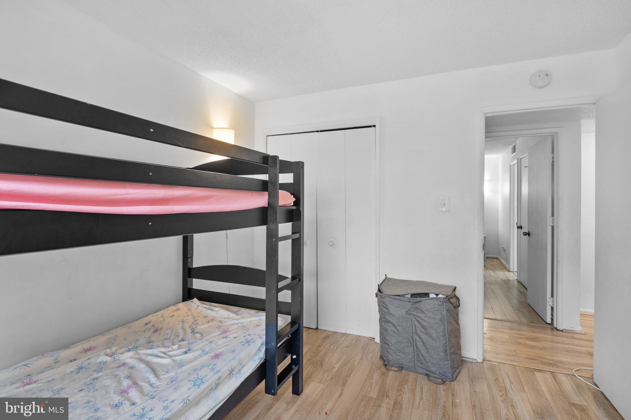 1824 Metzerott Road, Unit B5 Adelphi, MD 20783 - Photo 12 of 25 a bedroom with a bed and a dresser