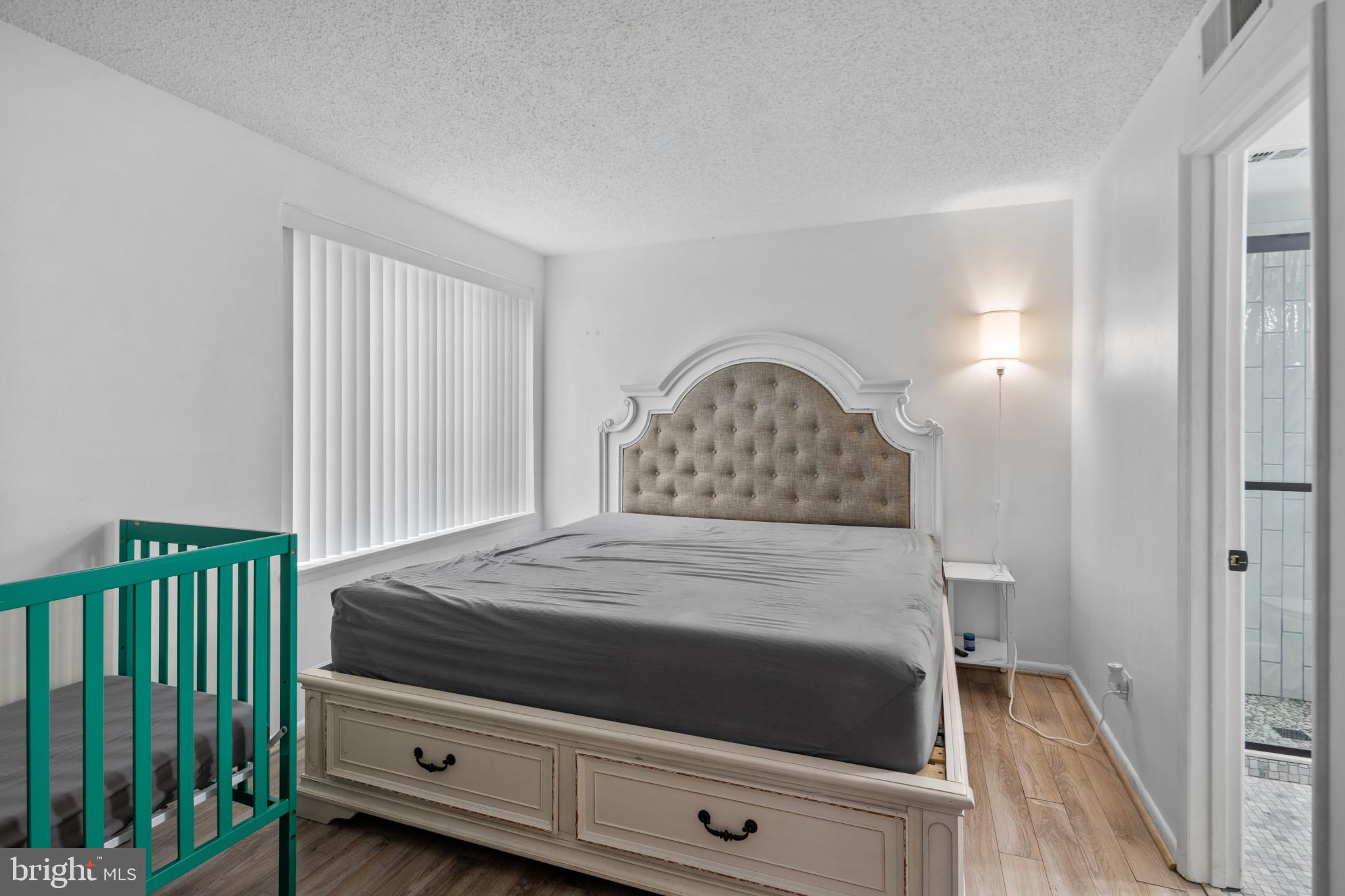 1824 Metzerott Road, Unit B5 Adelphi, MD 20783 - Photo 13 of 25 a bedroom with a bed and a dresser