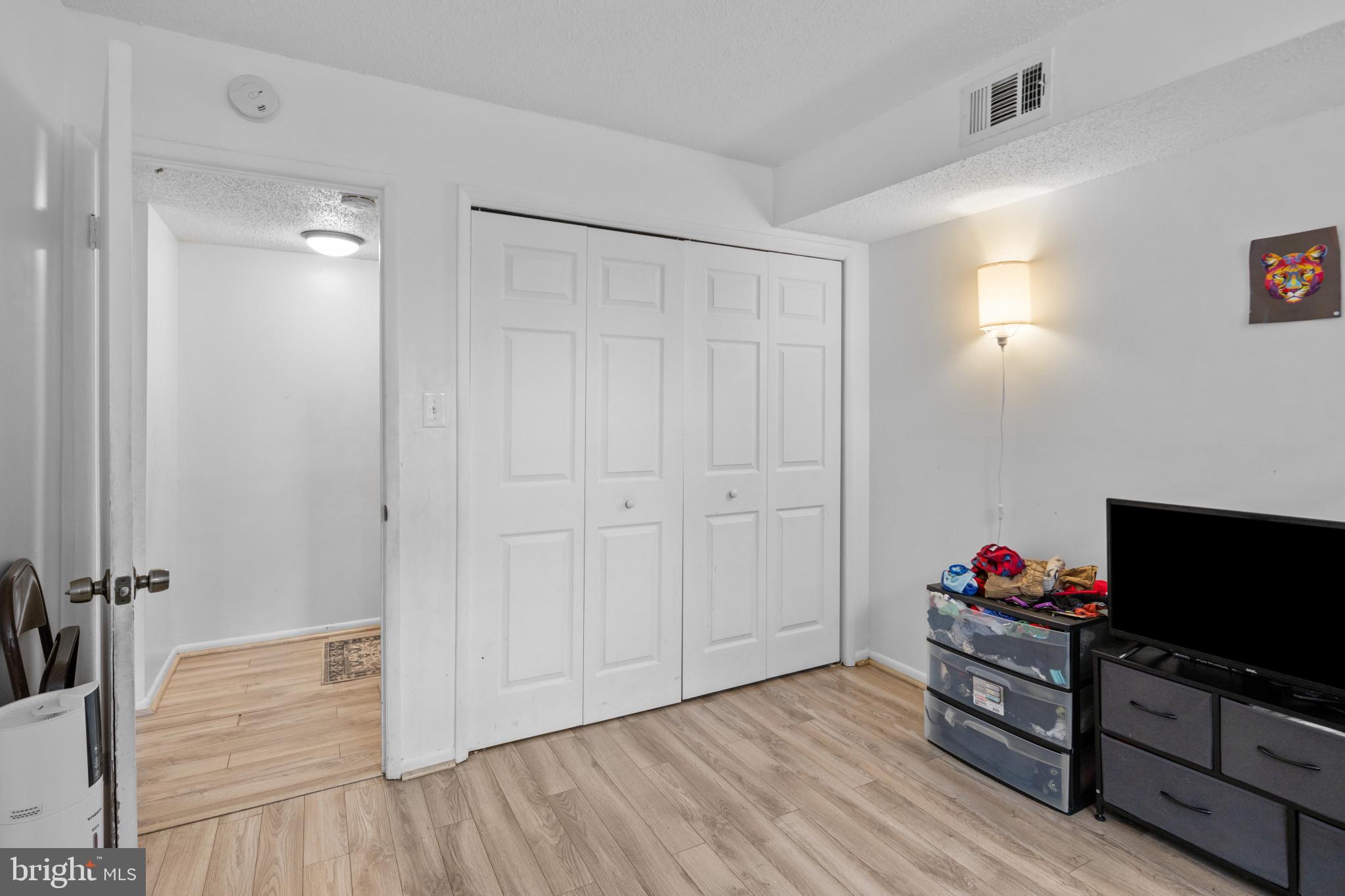 1824 Metzerott Road, Unit B5 Adelphi, MD 20783 - Photo 16 of 25 a view of a livingroom with wooden floor and furniture