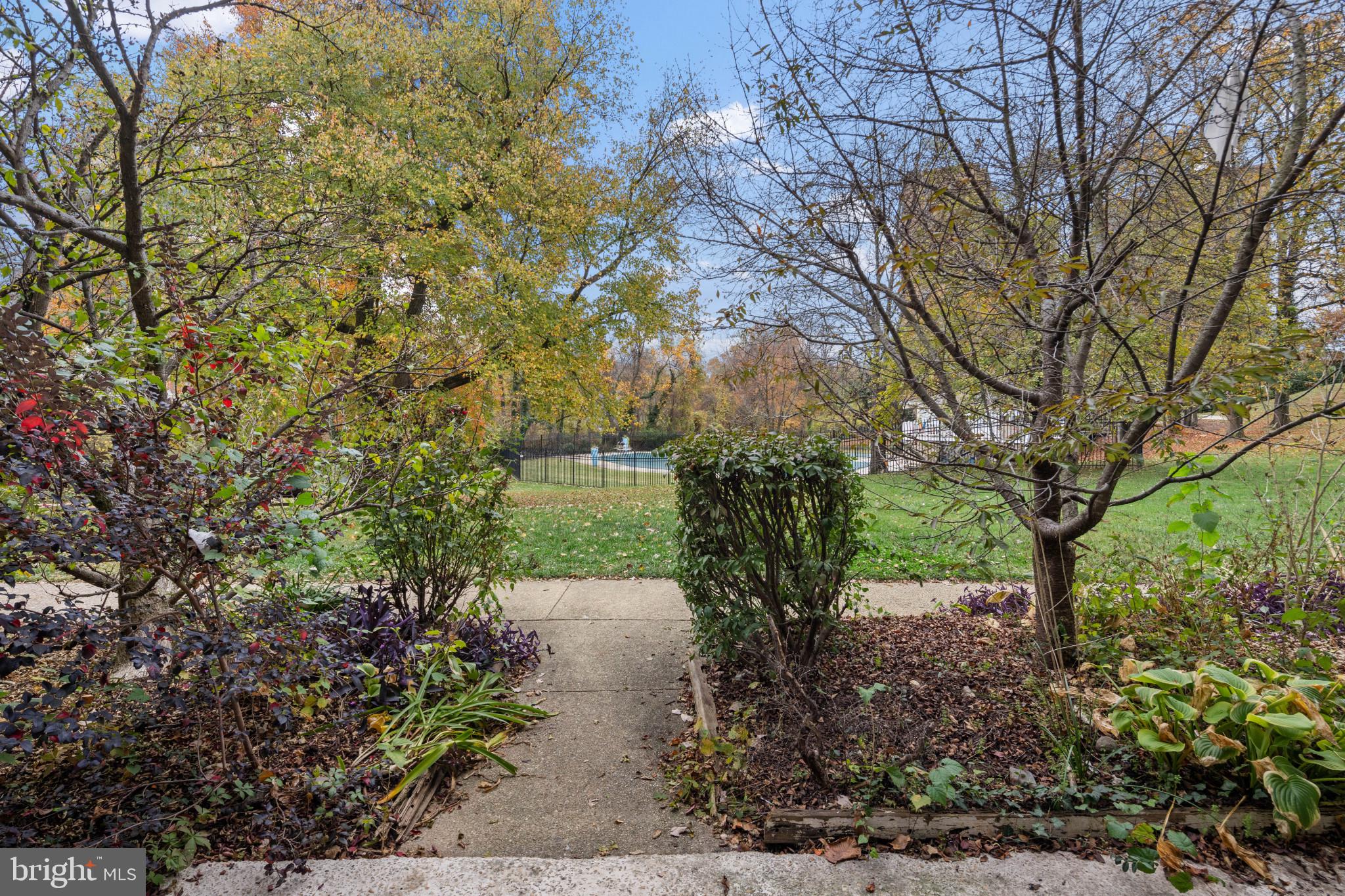1824 Metzerott Road, Unit B5 Adelphi, MD 20783 - Photo 17 of 25 a view of a yard with plants and trees