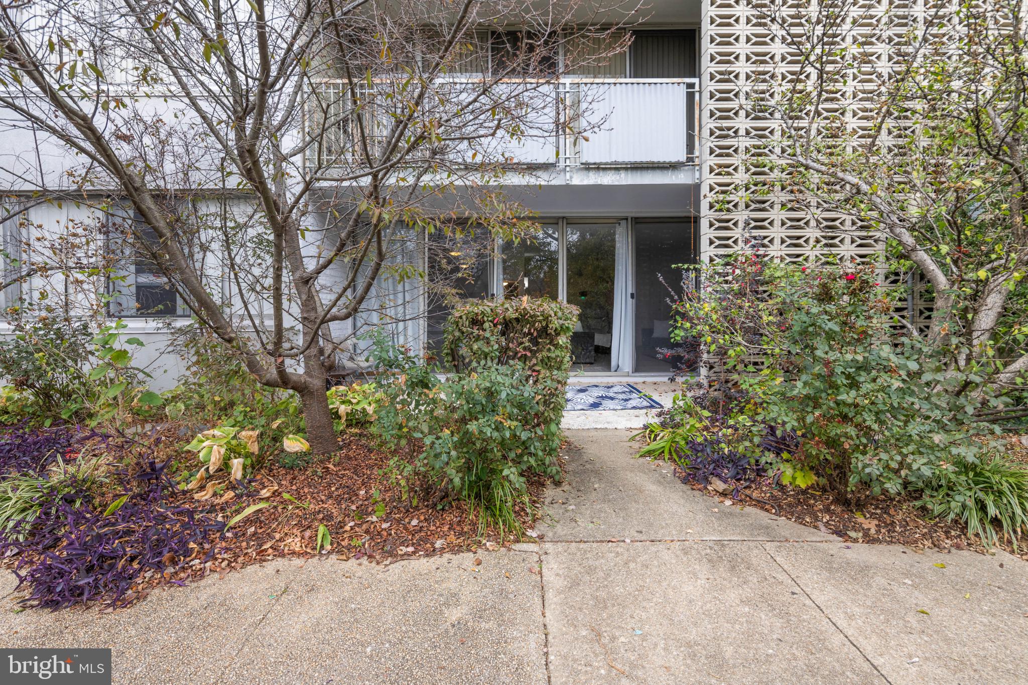 1824 Metzerott Road, Unit B5 Adelphi, MD 20783 - Photo 19 of 25 a front view of a house with a garden