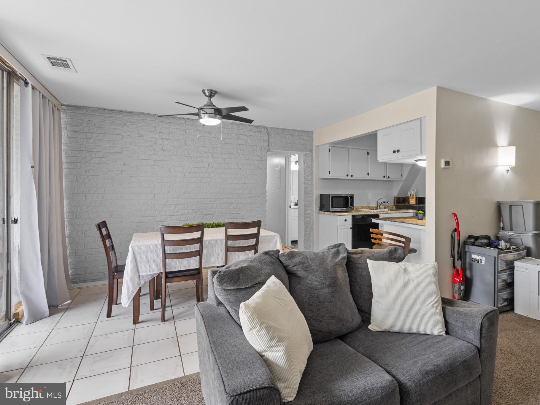 1824 Metzerott Road, Unit B5 Adelphi, MD 20783 - Photo 5 of 25 a living room with furniture and kitchen view
