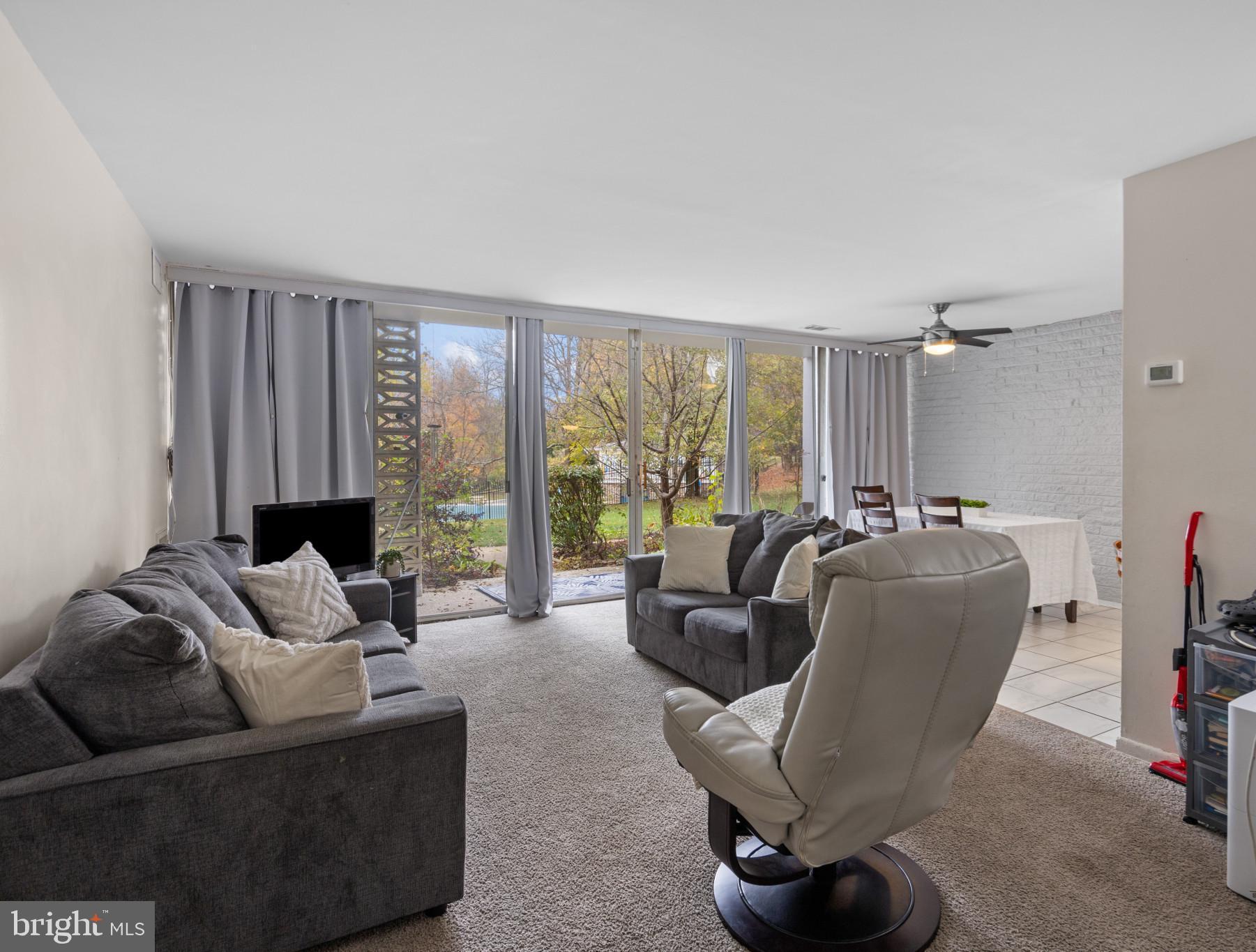 1824 Metzerott Road, Unit B5 Adelphi, MD 20783 - Photo 8 of 25 a living room with furniture and a large window
