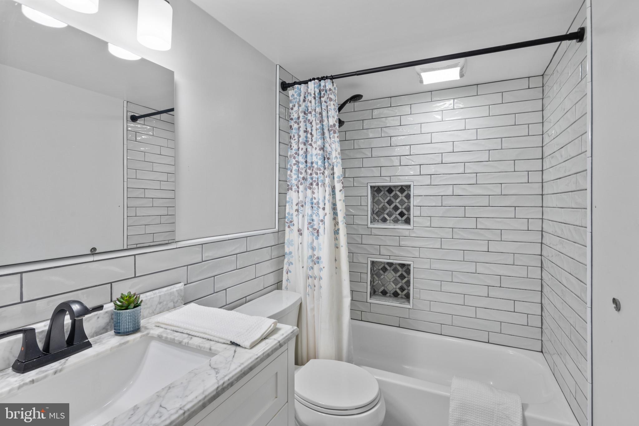 1824 Metzerott Road, Unit B5 Adelphi, MD 20783 - Photo 10 of 25 a bathroom with a sink toilet and shower