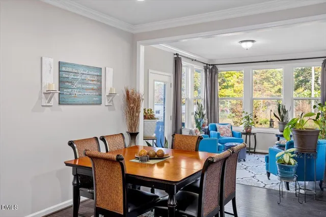 a view of a dining room with furniture window and outside view