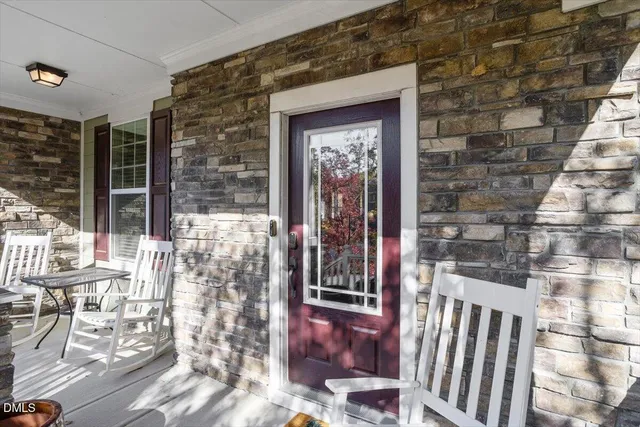 a view of porch with a bench