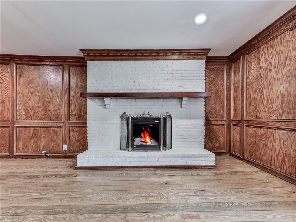 633 Butterworth Road Canton, GA 30114 - Photo 19 of 55 a living room with stainless steel appliances furniture a fireplace and a wooden floor