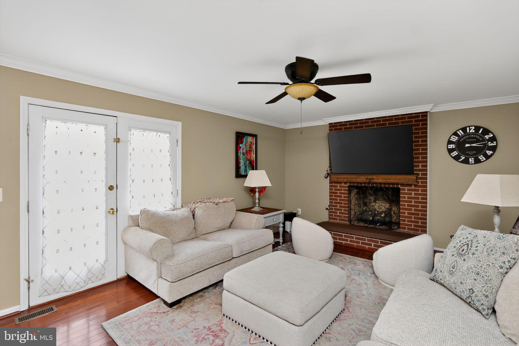 16601 Accolon Court Dumfries, VA 22025 - Photo 14 of 34 a living room with furniture and a fireplace