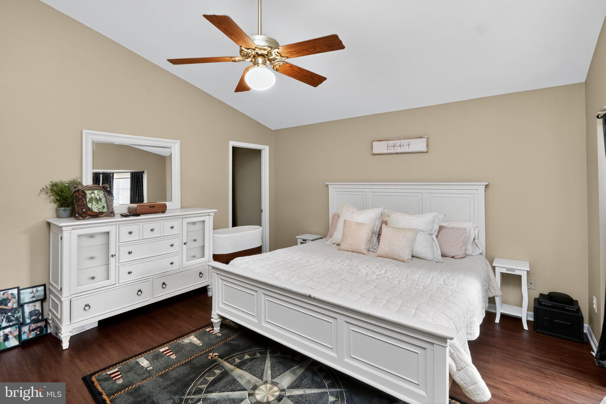 16601 Accolon Court Dumfries, VA 22025 - Photo 20 of 34 a bedroom with a bed and a dresser