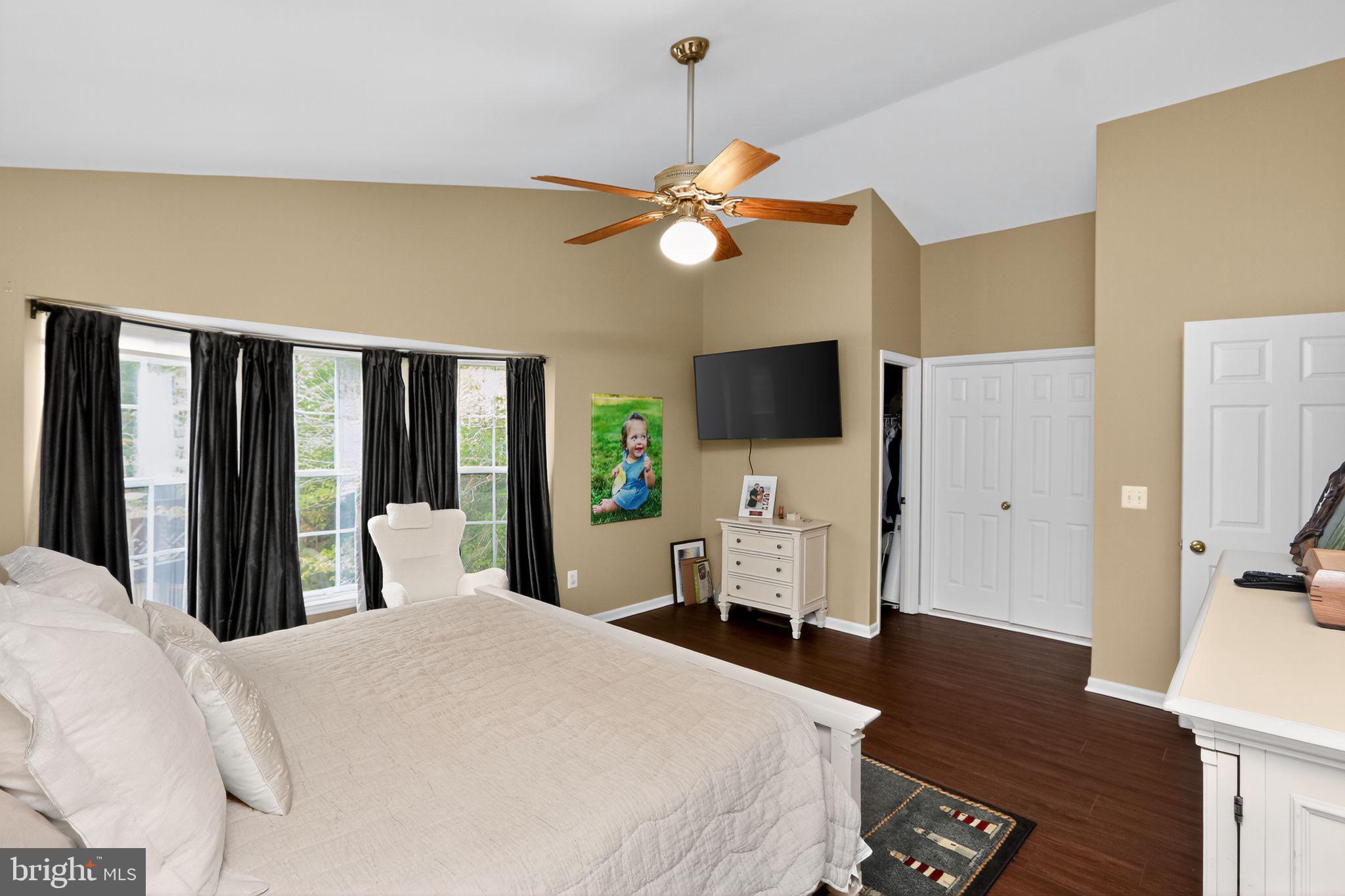 16601 Accolon Court Dumfries, VA 22025 - Photo 21 of 34 a bedroom with a bed and a flat tv screen on dresser