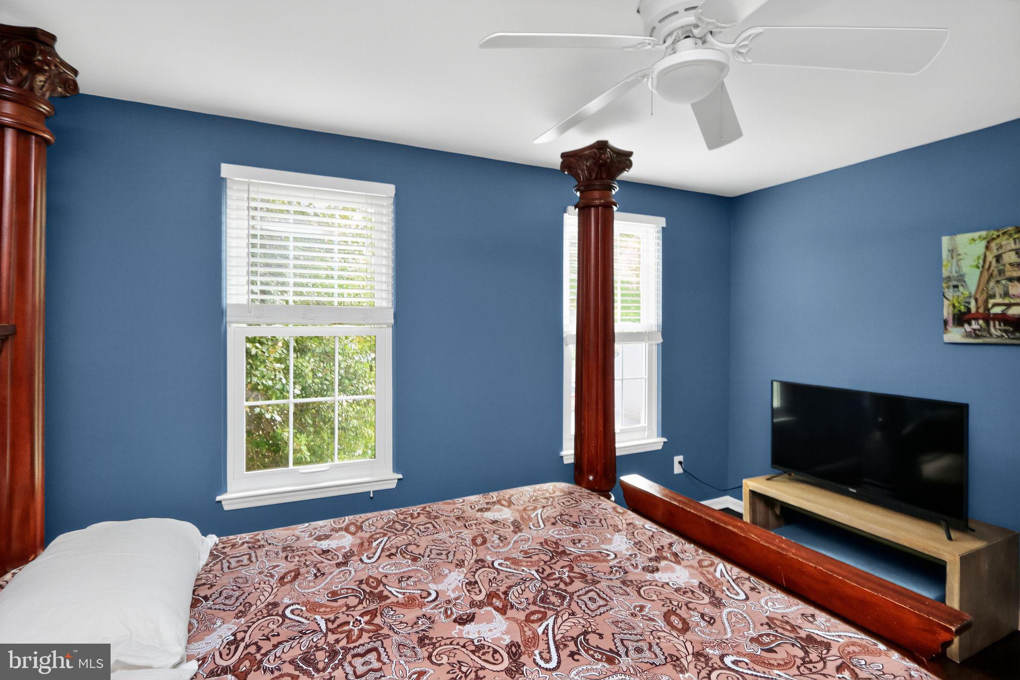16601 Accolon Court Dumfries, VA 22025 - Photo 24 of 34 a bedroom with a bed and a flat screen tv